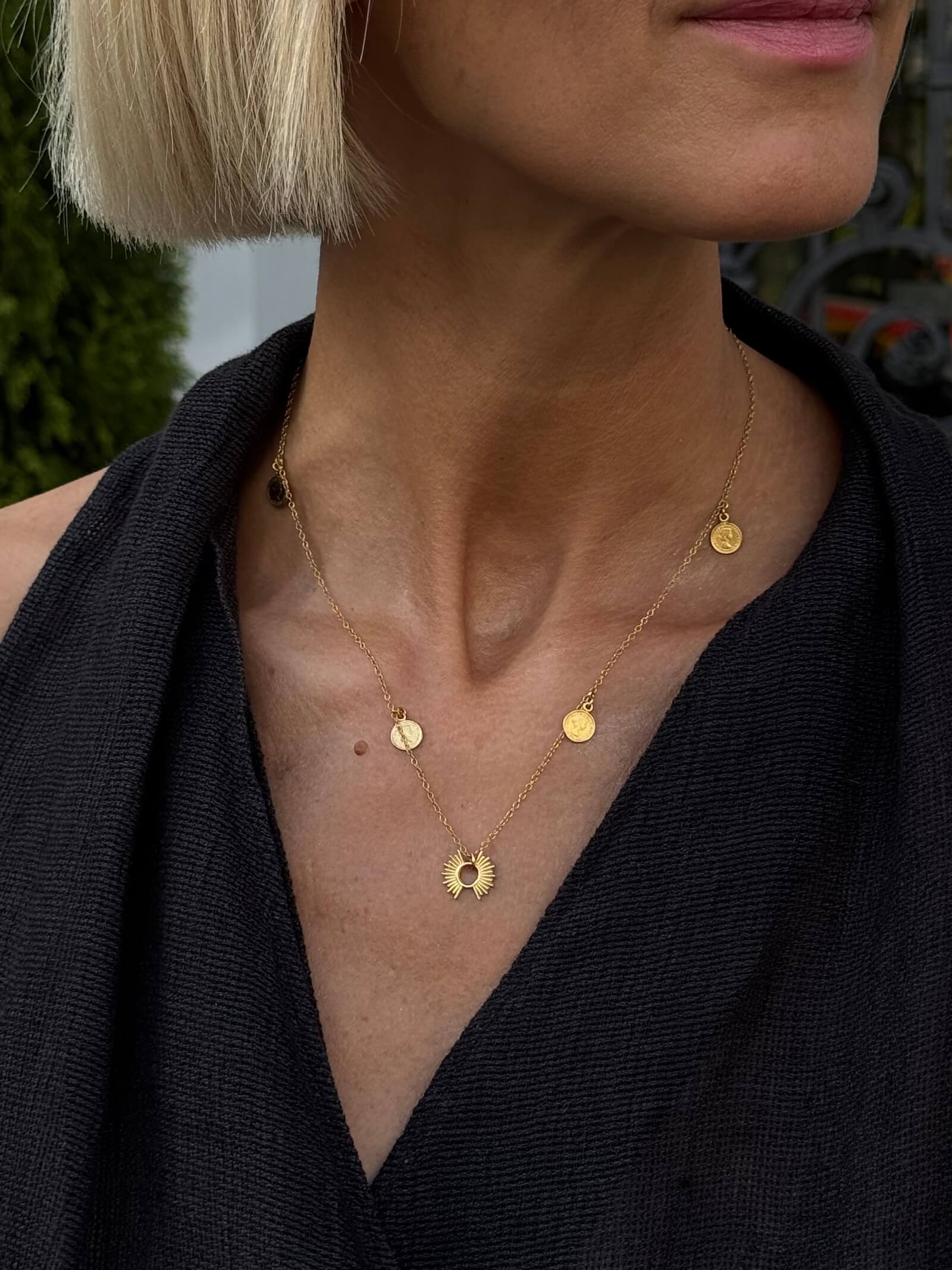 Gold-plated chain with a sun